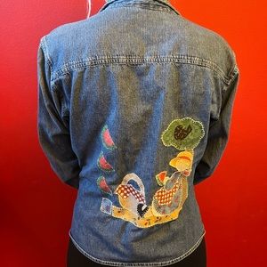 Denim look a like jacket that is 100%cotton. Mother goose quilt work. Size L